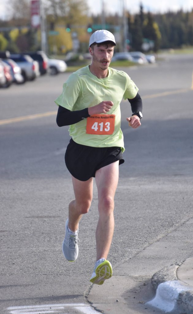Jacob Marshall runs the final leg of the marathon relay at the Kenai River Marathon on Sunday, Sept. 24, 2023, in Kenai, Alaska. Marshall, Rustin Hitchcock, Patrick Metzger and Daniel Serventi, under team name Navigationally Challenged, won. (Photo by Jeff Helminiak/Peninsula Clarion)