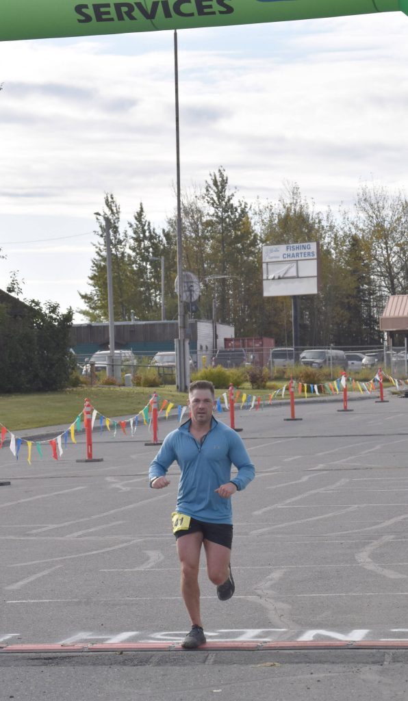 Rob Parrish of Kenai wins the mens half marathon at the Kenai River Marathon on Sunday, Sept. 24, 2023, in Kenai, Alaska. (Photo by Jeff Helminiak/Peninsula Clarion)