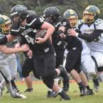 Nikiski's Truit McCaughey tries to break the tackle of Seward's Judah Brueckner on Saturday, Sept. 16, 2023, at Nikiski Middle-High School in Nikiski, Alaska. (Photo by Jeff Helminiak/Peninsula Clarion)