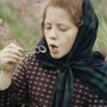 Abby Lancashire, probably in her early teens, blowing bubbles on the family homestead. (Photo courtesy of the Lancashire Family Collection.)