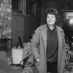 Rusty Lancashire smiles for the camera in the frame house that in the late 1950s replaced the Lancashires original homestead log cabin. (Photo courtesy of the Lancashire Family Collection)