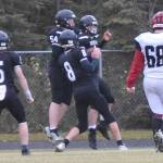 Nikiski's Everett Chamberlain, Lynn Deveer, Seth Payne and Oliver Parrish celebrate the touchdown run of Parrish on Saturday, Sept. 30, 2023, at Nikiski Middle-High School in Nikiski, Alaska. (Photo by Jeff Helminiak/Peninsula Clarion)