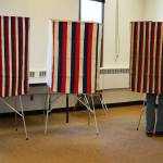 A lone voter fills in their ballot at Soldotna Prep School in Soldotna, Alaska, during election day on Tuesday, Oct. 3, 2023. (Jake Dye/Peninsula Clarion)