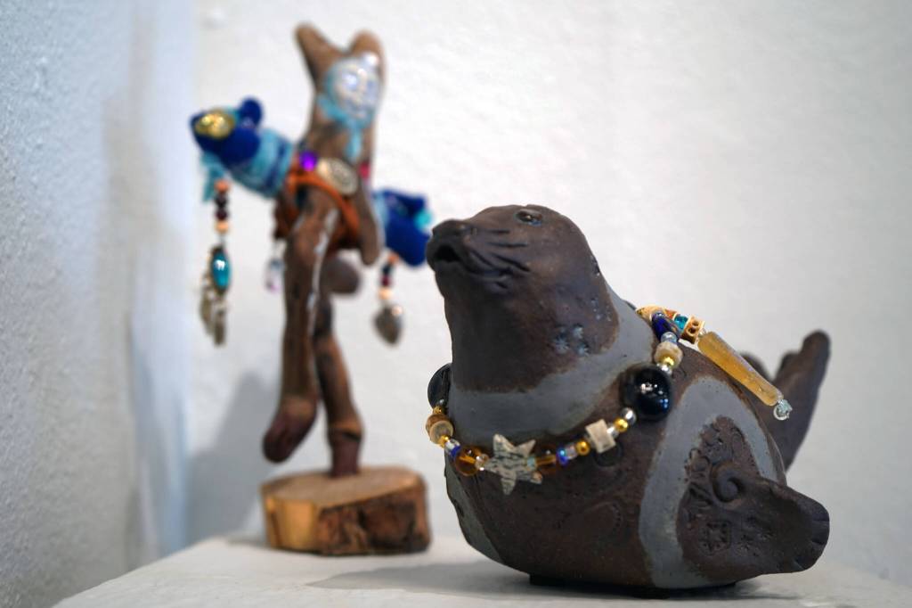 A sculpture by Laura Faeo, right, is included in the Biennial Judged Show at Kenai Art Center in Kenai, Alaska, on Wednesday, Oct. 4, 2023. (Jake Dye/Peninsula Clarion)