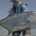 An angler holds up a massive fish in Jacks: A Film by Jako Lucas & Ra Beattie. (Photo courtesy International Fly Fishing Festival)