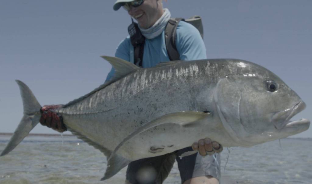 An angler holds up a massive fish in Jacks: A Film by Jako Lucas & Ra Beattie. (Photo courtesy International Fly Fishing Festival)