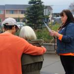 Kenaitze Tribal Elder Sharon Isaak comforts boarding school survivor Mary Hunt while Traditional Healer Karen Trulove reads a prayer at Ggugguyni T'uh, "Raven Place," outside the Dena'ina Wellness Center on Friday, Oct. 6, 2023 in Kenai, Alaska. Orange Shirt Day honors indigenous elders who survived and children lost from boarding schools established to detribalize indigenous people. (Ashlyn O'Hara/Peninsula Clarion)
