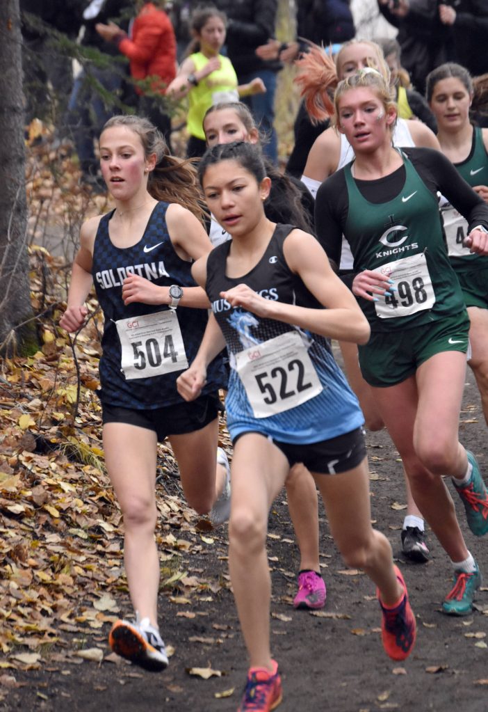 Soldotnas Tania Boonstra tucks in with a chase pack Saturday, Oct. 7, 2023, in the Division I girls state cross-country race at Palmer High School in Palmer, Alaska. (Photo by Jeff Helminiak/Peninsula Clarion)