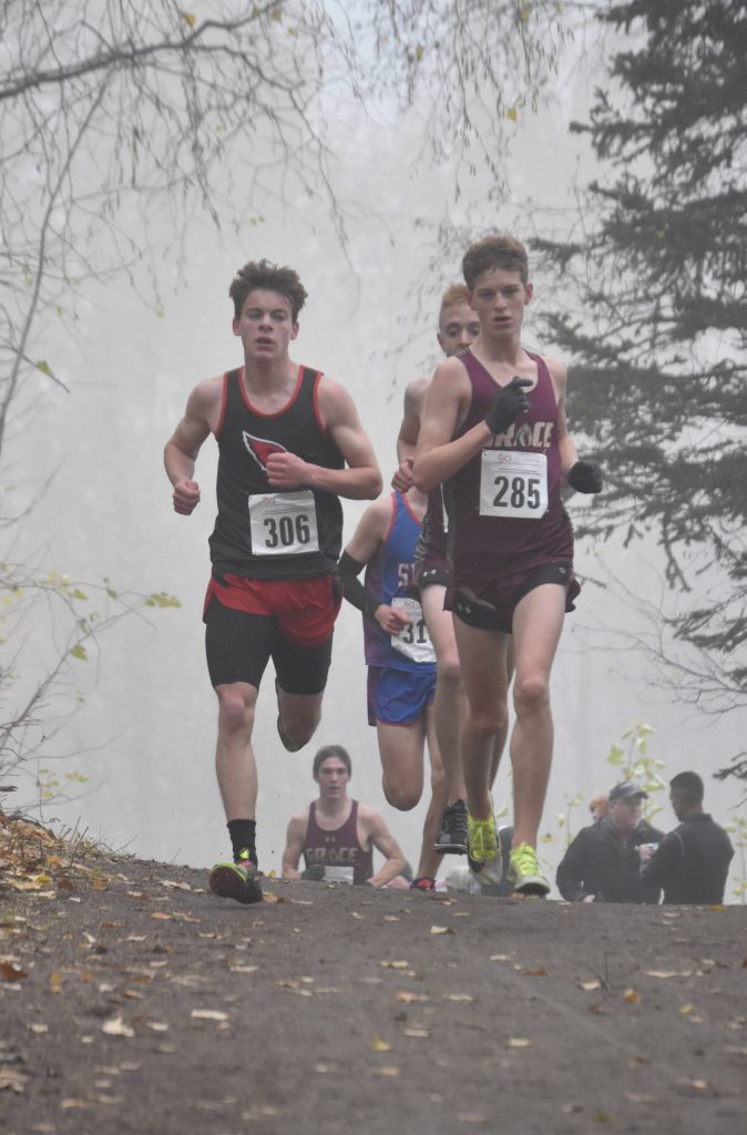 Kenai Centrals Greg Fallon and Grace Christians Robbie Annett lead the pack Saturday, Oct. 7, 2023, in the Division II boys state cross-country race at Palmer High School in Palmer, Alaska. (Photo by Jeff Helminiak/Peninsula Clarion)