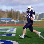 Soldotnas Gehret Medcoff lands a touchdown during a Division II playoff game at Justin Maile Field in Soldotna, Alaska, on Saturday, Oct. 7, 2023. (Jake Dye/Peninsula Clarion)
