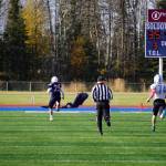 Soldotnas Gehret Medcoff completes a 95 yard run for a touchdown, pursued by Chugiaks Ethan Maddox, during a Division II playoff game at Justin Maile Field in Soldotna, Alaska, on Saturday, Oct. 7, 2023. (Jake Dye/Peninsula Clarion)