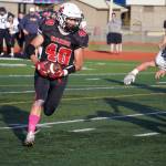 Kenais Bobby Hayes runs with the ball during a Division III playoff game at Justin Maile Field in Soldotna, Alaska, on Saturday, Oct. 7, 2023. (Jake Dye/Peninsula Clarion)