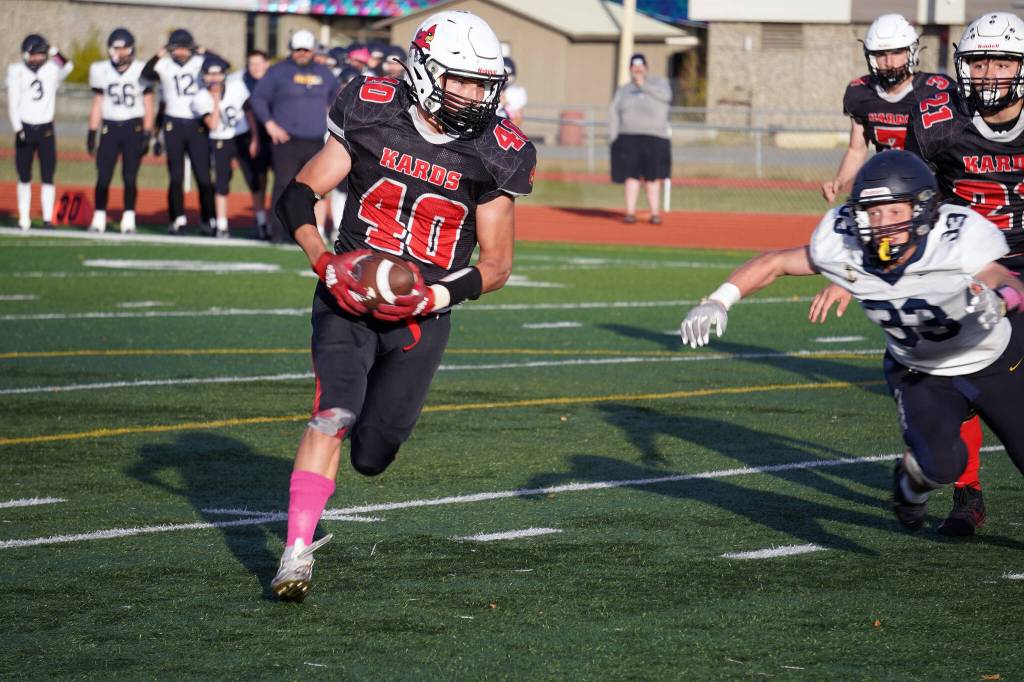 Kenais Bobby Hayes runs with the ball during a Division III playoff game at Justin Maile Field in Soldotna, Alaska, on Saturday, Oct. 7, 2023. (Jake Dye/Peninsula Clarion)