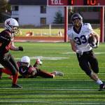 Homers Jake Tappan runs with the ball during a Division III playoff game at Justin Maile Field in Soldotna, Alaska, on Saturday, Oct. 7, 2023. (Jake Dye/Peninsula Clarion)