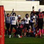 Kenais Zeke Yragui rises after scoring a touchdown with less than a minute left during a Division III playoff game at Justin Maile Field in Soldotna, Alaska, on Saturday, Oct. 7, 2023. (Jake Dye/Peninsula Clarion)