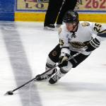 Kenai Rivers John Ross moves with the puck during a hockey game at Soldotna Regional Sports Complex in Soldotna, Alaska, on Saturday, Oct. 7, 2023. (Jake Dye/Peninsula Clarion)