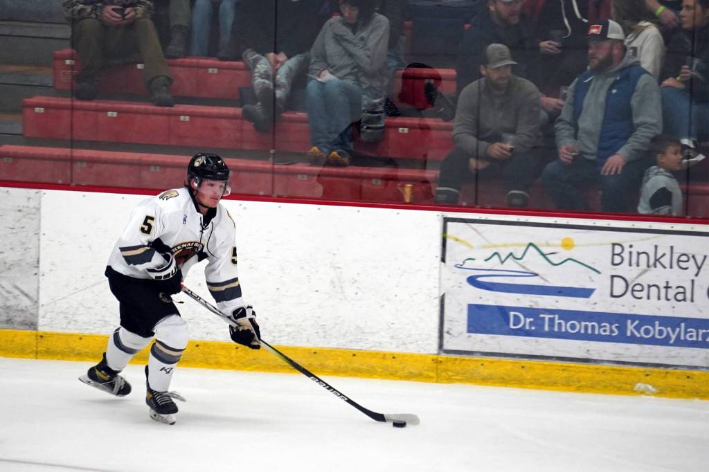 Kenai Rivers Blake Norris moves with the puck during a hockey game at Soldotna Regional Sports Complex in Soldotna, Alaska, on Saturday, Oct. 7, 2023. (Jake Dye/Peninsula Clarion)