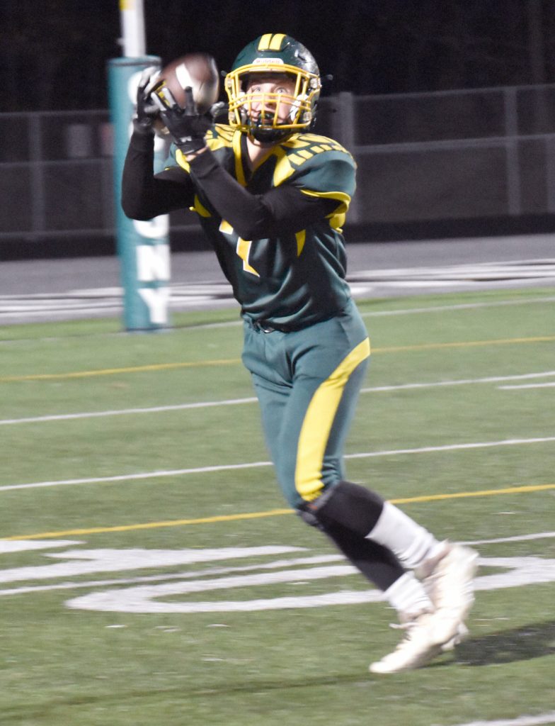 Sewards Judah Brueckner catches a touchdown pass against Nikiski on Saturday, Oct. 7, 2023, in the nine-man football state final at Colony High School in Palmer, Alaska. (Photo by Jeff Helminiak/Peninsula Clarion)
