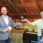 Photo courtesy Josiah Martin/Kenai Peninsula Food Bank
Jon Kruger hands an award for Trophy Catch of the Day to a participant of Catching for a Cause at the Cannery Lodge in Kenai.