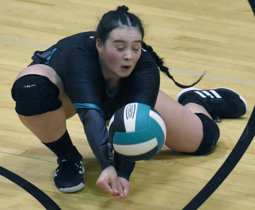 Nikiskis Kailey Stynsberg digs up a ball against Homer on Thursday, Oct. 12, 2023 at Nikiski Middle-High School in Nikiski, Alaska. (Photo by Jeff Helminiak/Peninsula Clarion)
