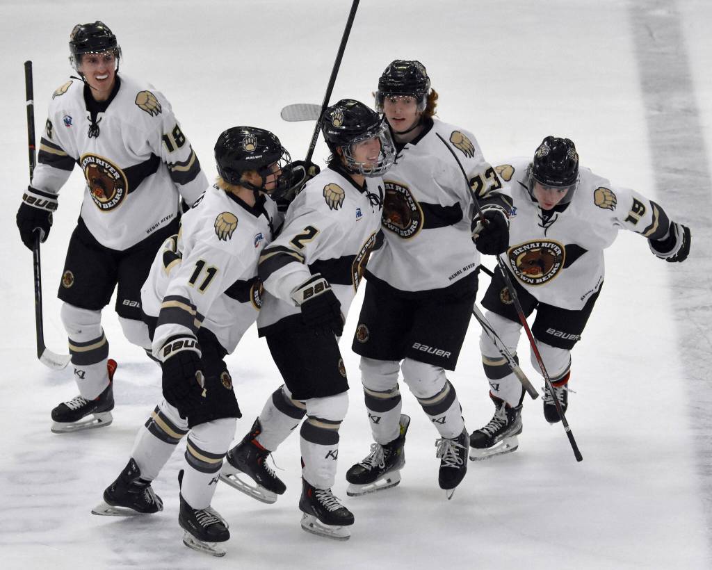 The Kenai River Brown Bears celebrate the goal of Marko Giourof (19) on Friday, Oct. 13, 2023, at the Soldotna Regional Sports Complex in Soldotna, Alaska. Giourof tipped in the shot of Joe Manning (2). (Photo by Jeff Helminiak/Peninsula Clarion)