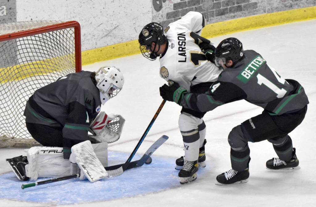 Minnesota Wilderness goalie Adam Prokop stops Andy Larson of the Kenai River Brown Bears in front of Nolan Bettens of the Wilderness on Friday, Oct. 13, 2023, at the Soldotna Regional Sports Complex in Soldotna, Alaska. (Photo by Jeff Helminiak/Peninsula Clarion)