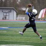 Soldotnas Andon Wolverton leaps to catch the ball in the Division II semifinal against North Pole at Justin Maile Field in Soldotna, Alaska, on Saturday, Oct. 14, 2023. (Jake Dye/Peninsula Clarion)