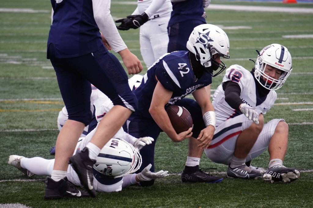 Soldotnas Jaykob Kemp rises after a scoring a touchdown while playing in the Division II semifinal against North Pole at Justin Maile Field in Soldotna, Alaska, on Saturday, Oct. 14, 2023. (Jake Dye/Peninsula Clarion)