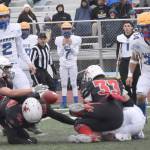 Kenai Centrals Cole Langham recovers a fumble against Barrow on Saturday, Oct. 14, 2023, in the Division III state championship game at Service High School in Anchorage, Alaska. (Photo by Jeff Helminiak/Peninsula Clarion)