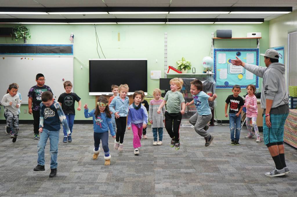 Jake Dye/Peninsula Clarion
Jessie Soyangco, right, leads a class of kindergarteners in dancing to a remix of the Little Einsteins theme song at Kaleidoscope School of Arts and Science in Kenai on Thursday.