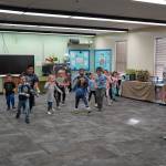Jessie Soyangco, right, leads a class of kindergarteners in dancing to a remix of the Little Einsteins theme song at Kaleidoscope School of Arts and Science in Kenai, Alaska, on Thursday, Oct. 19, 2023. (Jake Dye/Peninsula Clarion)