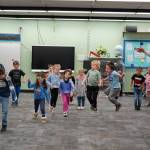 Jessie Soyangco, right, leads a class of kindergarteners in dancing to a remix of the Little Einsteins theme song at Kaleidoscope School of Arts and Science in Kenai, Alaska, on Thursday, Oct. 19, 2023. (Jake Dye/Peninsula Clarion)