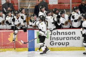Kenai River's Joe Manning (center) celebrates putting the Kenai River Brown Bears up 6-4 on Friday, Oct. 20, 2023, at the Soldotna Regional Sports Complex in Soldotna, Alaska. (Photo by Jeff Helminiak/Peninsula Clarion)