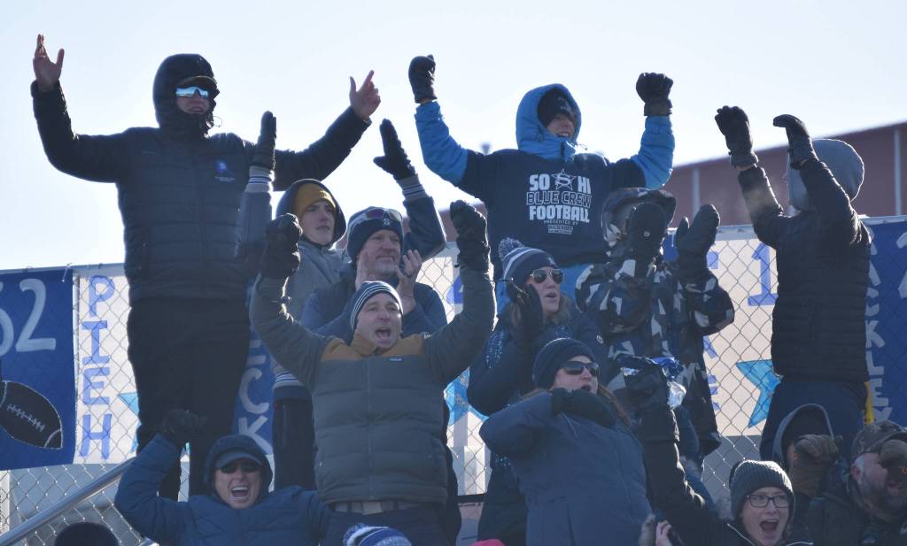 Soldotna fans celebrate a touchdown Saturday, Oct. 21, 2023, in the Division II championship game at Service High School in Anchorage, Alaska. (Photo by Jeff Helminiak/Peninsula Clarion)