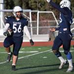 Soldotnas Koda Lepule celebrates a fumble recovery with Elijah Lee on Saturday, Oct. 21, 2023, in the Division II championship game at Service High School in Anchorage, Alaska. (Photo by Jeff Helminiak/Peninsula Clarion)