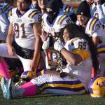 Lathrops Zedekiah Fanene poses with the runner-up trophy Saturday, Oct. 21, 2023, in the Division II championship game at Service High School in Anchorage, Alaska. (Photo by Jeff Helminiak/Peninsula Clarion)