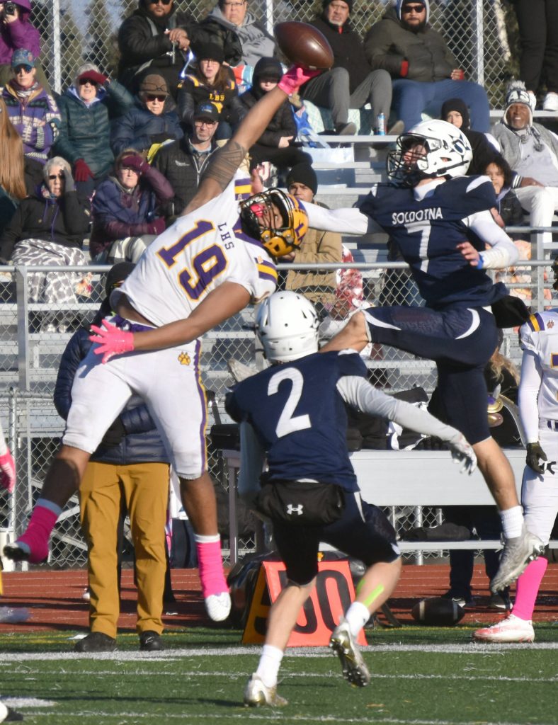 Lathrops Jirah Simeta and Soldotnas Zac Buckbee fight for an incomplete pass Saturday, Oct. 21, 2023, in the Division II championship game at Service High School in Anchorage, Alaska. (Photo by Jeff Helminiak/Peninsula Clarion)