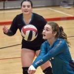 Nikiskis Evelyn Reichert digs up a ball against Kenai Central on Tuesday, Oct. 24, 2023, at Kenai Central High School in Kenai, Alaska. (Photo by Jeff Helminiak/Peninsula Clarion)