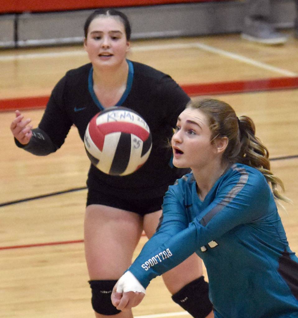 Nikiskis Evelyn Reichert digs up a ball against Kenai Central on Tuesday, Oct. 24, 2023, at Kenai Central High School in Kenai, Alaska. (Photo by Jeff Helminiak/Peninsula Clarion)
