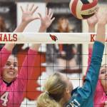 Kenai Central's Avia Miller and Grace Beiser put up a block on Nikiski's Mandee Roofe on Tuesday, Oct. 24, 2023, at Kenai Central High School in Kenai, Alaska. (Photo by Jeff Helminiak/Peninsula Clarion)