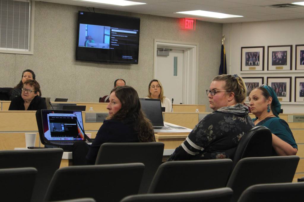 From left: Nikolaevsk charter school academic policy committee members Mariah Kerrone, Chandra Caffroy and Juliana McConnell present their updated charter application to the Kenai Peninsula Borough School District Board of Education on Monay, Oct. 23, 2023 in Soldotna, Alaska. (Ashlyn OHara/Peninsula Clarion)