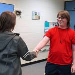 Lincoln Kimbell shakes hands with Boyd Lehmberg after winning the final round of a Super Smash Bros. Ultimate match at Nikiski Middle/High School in Nikiski, Alaska, on Monday, Oct. 23, 2023. (Jake Dye/Peninsula Clarion)
