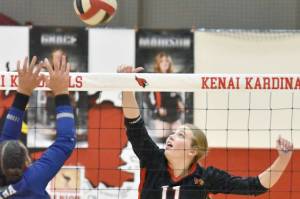 Kenai Central's Grace Beiser attacks against Soldotna's Athena Rossiter on Thursday, Oct. 26, 2023, at Kenai Central High School in Kenai, Alaska. (Photo by Jeff Helminiak/Peninsula Clarion)