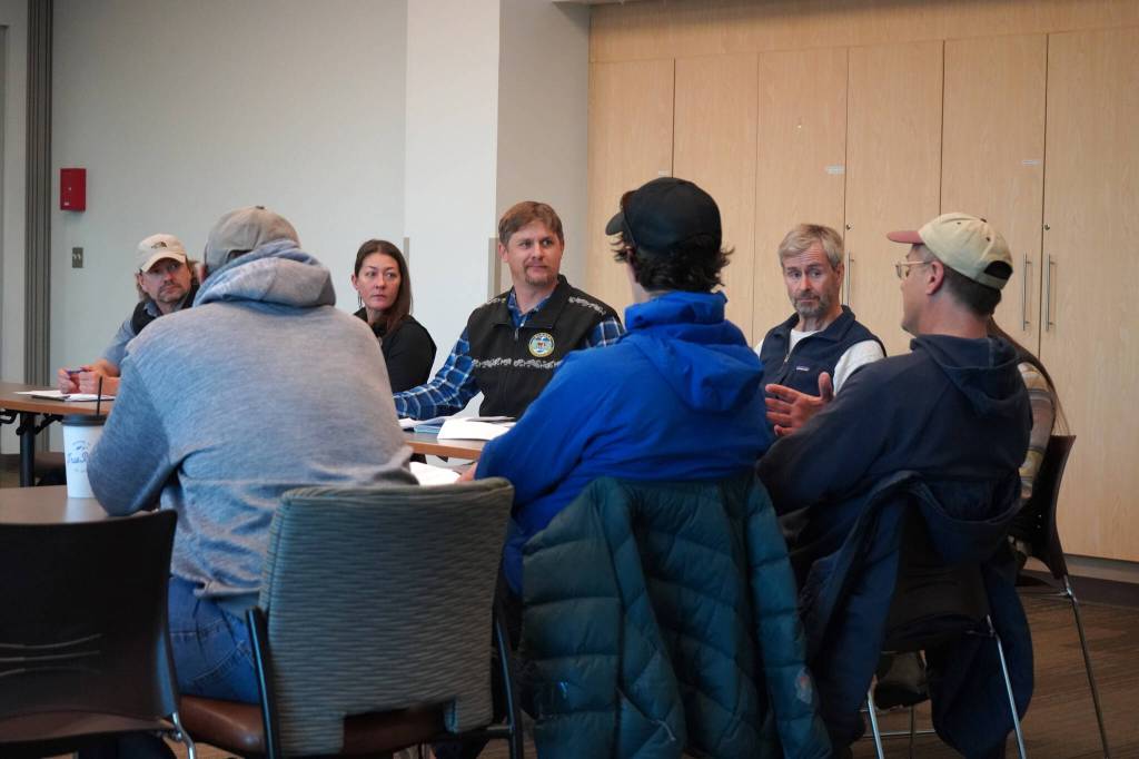 Members of the State Department of Fish and Games Division of Sport Fish listen to questions at a Town Hall Style Meeting held at Soldotna Public Library in Soldotna, Alaska, on Thursday, Oct. 26, 2023. (Jake Dye/Peninsula Clarion)