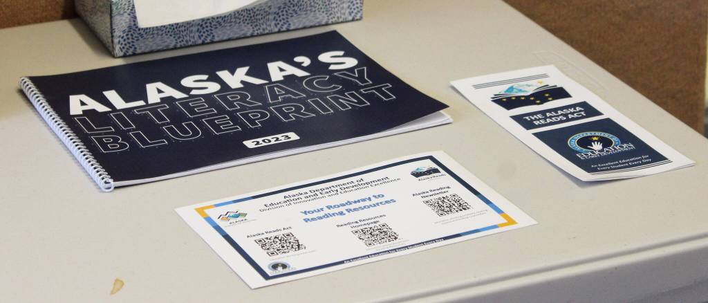 Materials with information about the Alaska Reads Act are displayed on a table near the entrance to Hope School on Wednesday, Oct. 18, 2023, in Hope, Alaska. (Ashlyn OHara/Peninsula Clarion)