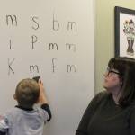 Students practice finding the letter M during a group activity led by Mountain View Elementary School Interventionist Katie Schneider on Thursday, Oct. 19, 2023, in Kenai, Alaska. (Ashlyn OHara/Peninsula Clarion)