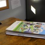 An Amplify CKLA book rests on Principal Dr. Mike Sturms desk at Razdolna School on Tuesday, Oct. 24, 2023, in Razdolna, Alaska. (Ashlyn OHara/Peninsula Clarion)