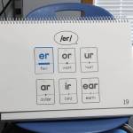 An Amplify CKLA flip book shows different ways to pronounce the sound /er/ inside Razdolna School Principal Dr. Mike Sturms office on Tuesday, Oct. 24, 2023, in Razdolna, Alaska. (Ashlyn OHara/Peninsula Clarion)