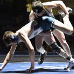 South's Zane Gerlach wrestles to victory against Soldotna's Trevor Michael on Friday, Nov. 3, 2023, at Soldotna High School in Soldotna, Alaska. (Photo by Jeff Helminiak/Peninsula Clarion)