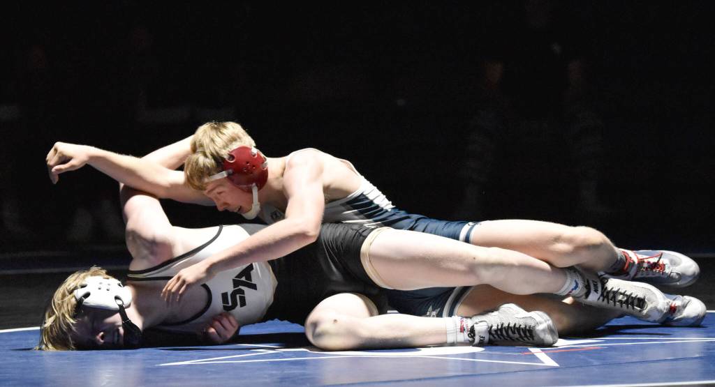 Soldotna's Jacob Strausbaugh wrestles to victory against South's Bohdan Porter on Friday, Nov. 3, 2023, at Soldotna High School in Soldotna, Alaska. (Photo by Jeff Helminiak/Peninsula Clarion)